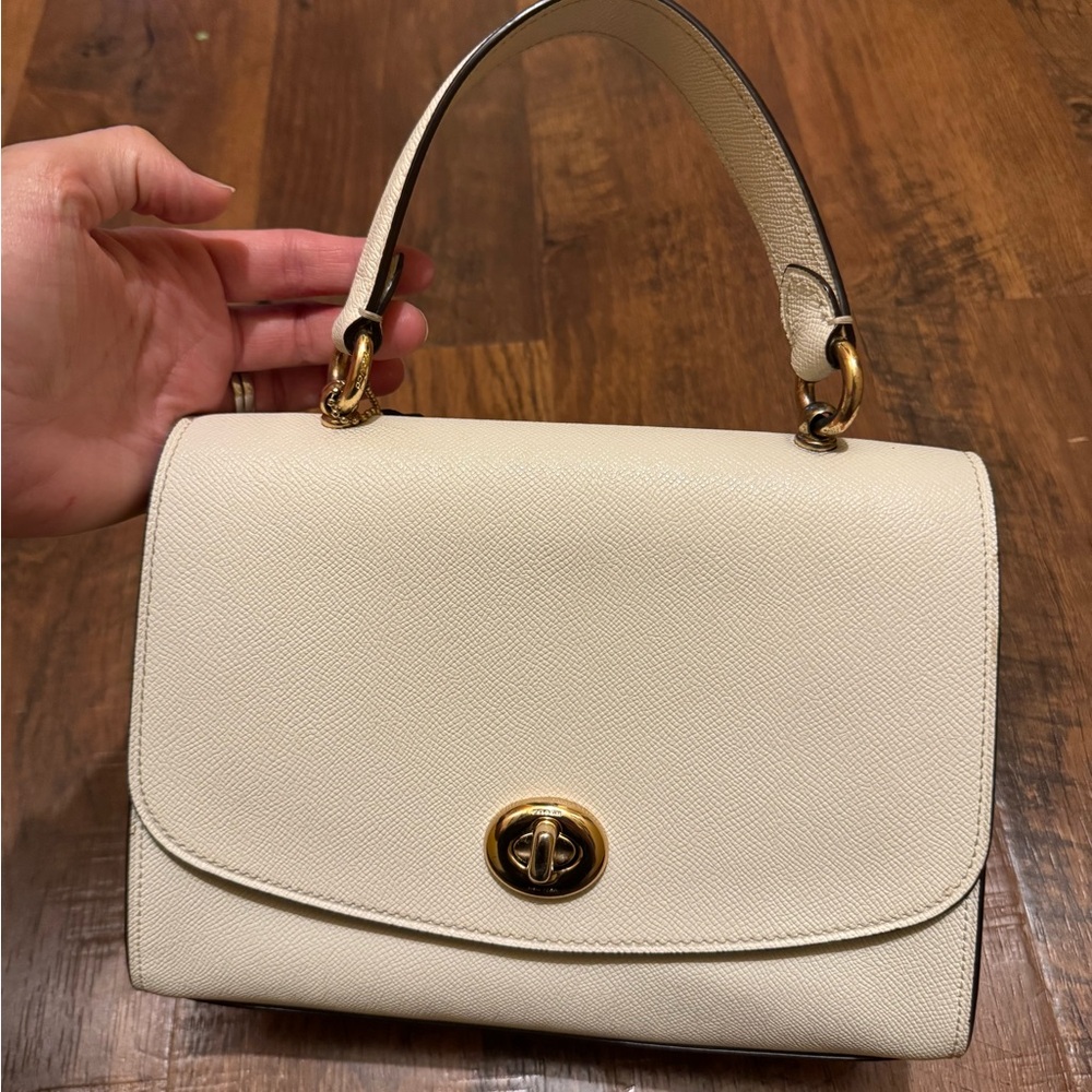 Coach Cream Hand Bag with Gold Hardware and Flap Closure